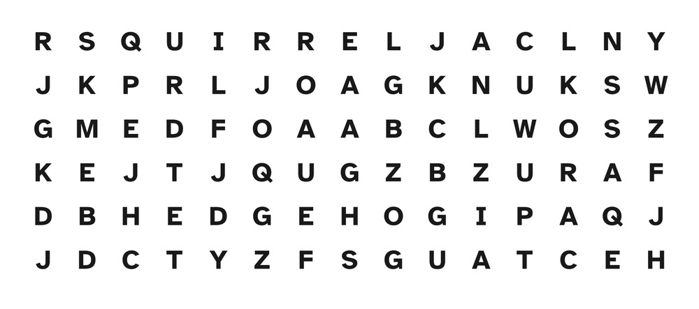 Close-up of a large print word search grid showing clearly distinguished letters, including a capital I with crossbars.